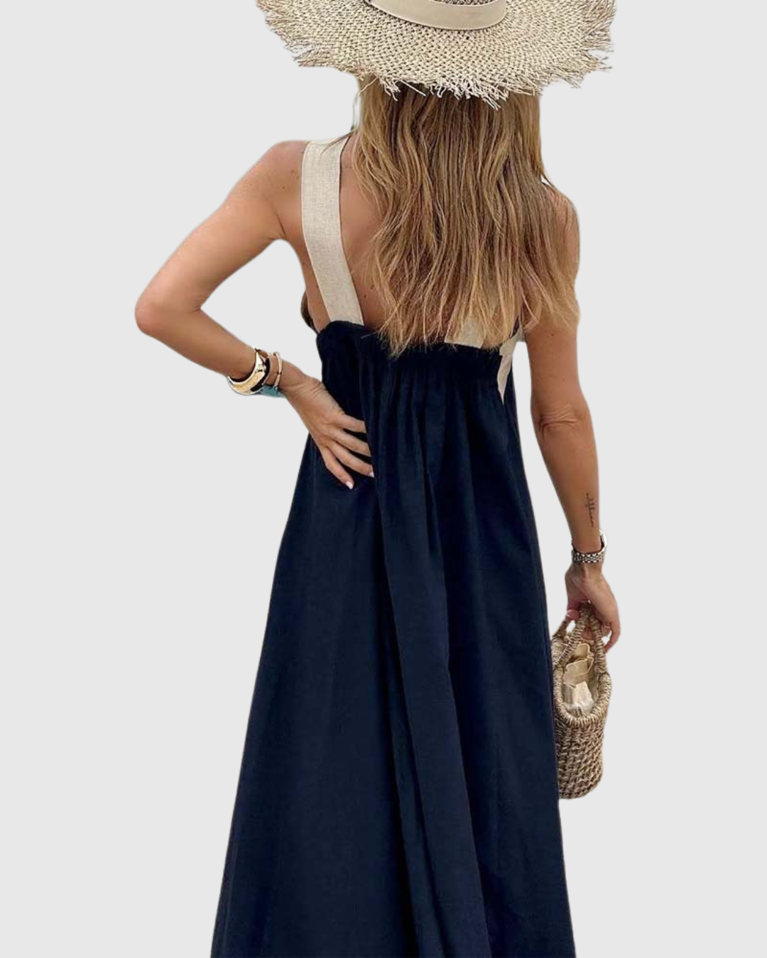 Backless navy maxi dress with beige cross-strap halter design