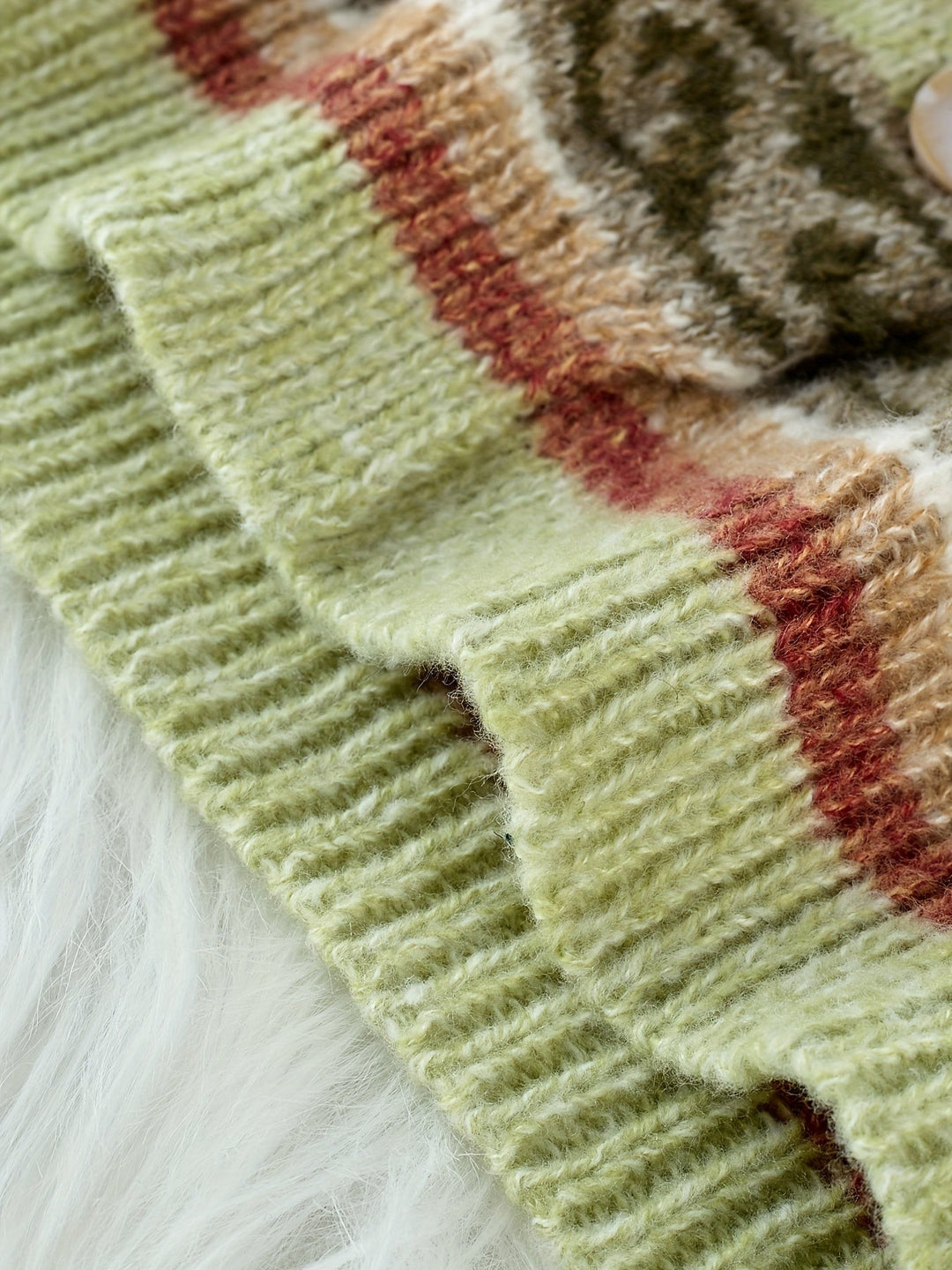 Close-up of charcoal ribbed knit fabric on Fair Isle cardigan