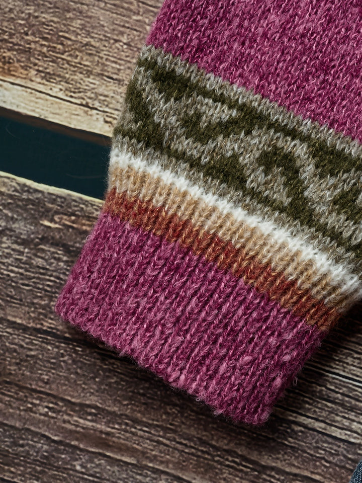 Magenta knit fabric close-up highlighting chunky ribbed weave