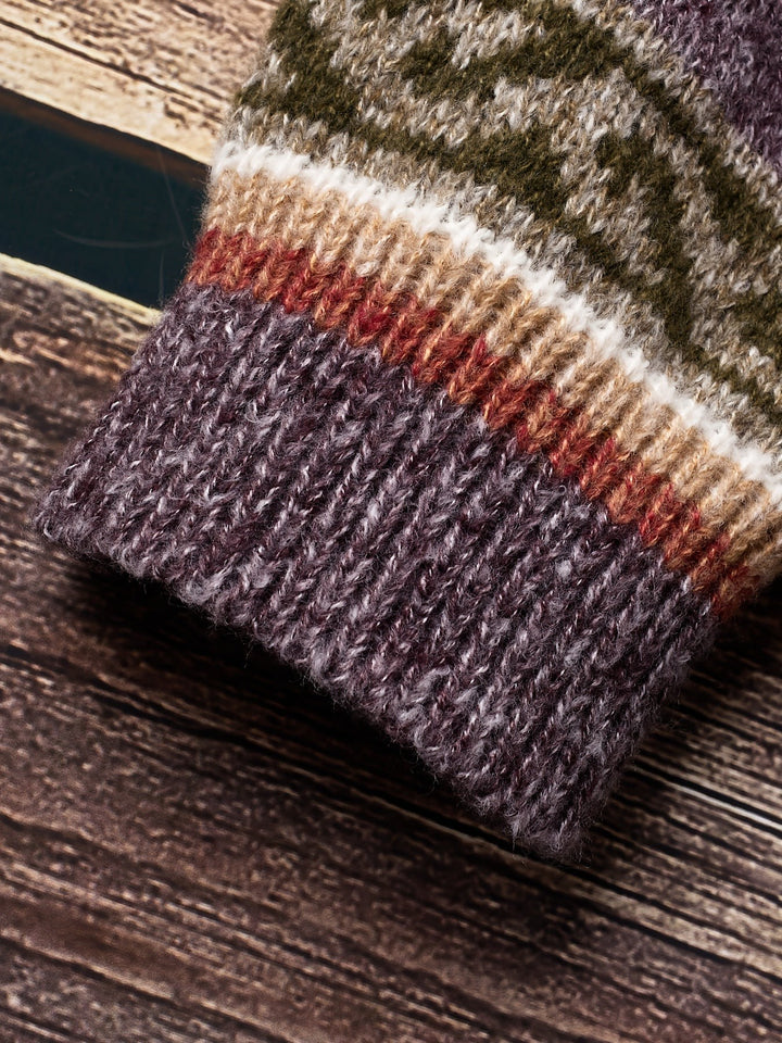 Folded purple knit fabric showing ribbed texture and colour blocking