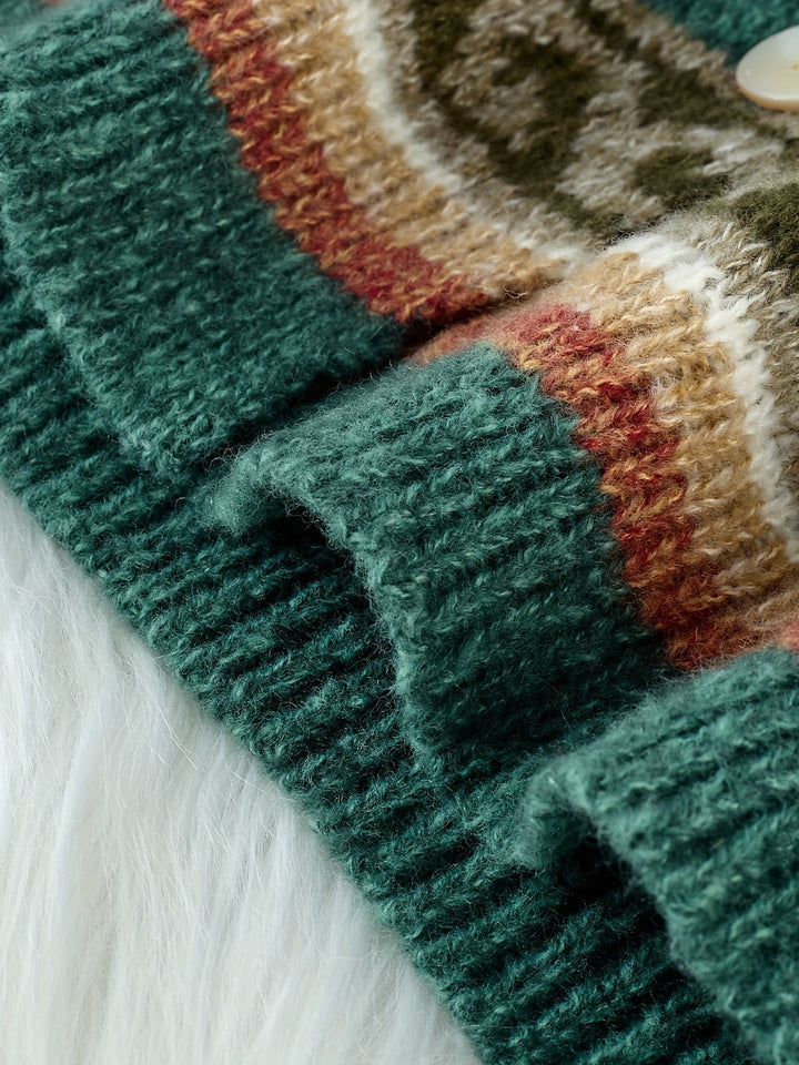 Close-up of ribbed teal knit fabric folded on patterned cardigan