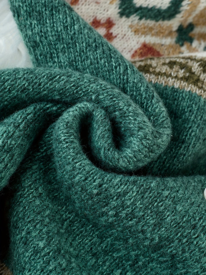 Teal knit cardigan fabric close-up showing chunky ribbed texture
