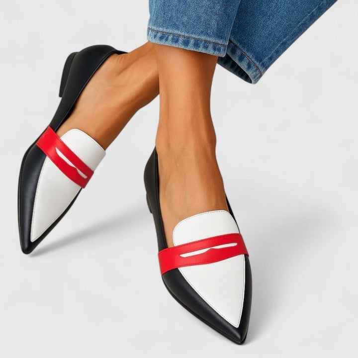 Pointed-toe loafers in black and white leather with red penny strap detail