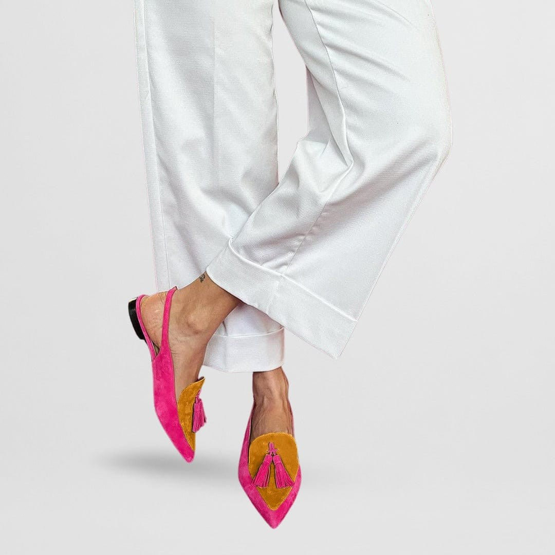 Pink and mustard yellow suede slingback flats featuring pointed toe and tassels