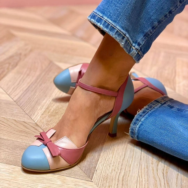 Blue and pink color-block ankle-strap heels with bow detail on pointed toe