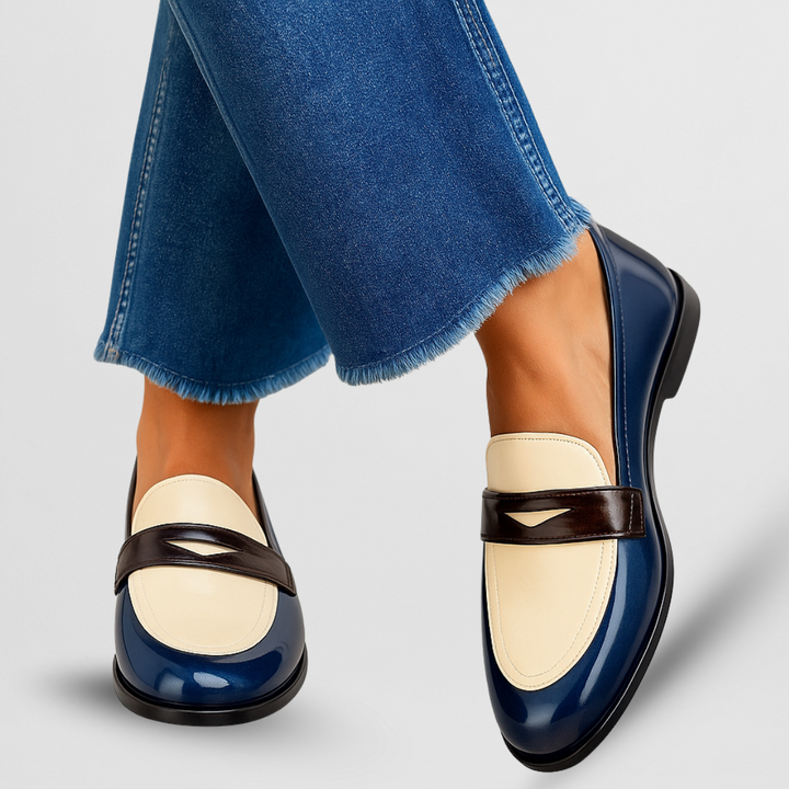 Navy patent leather penny loafers with cream and burgundy color-block panels
