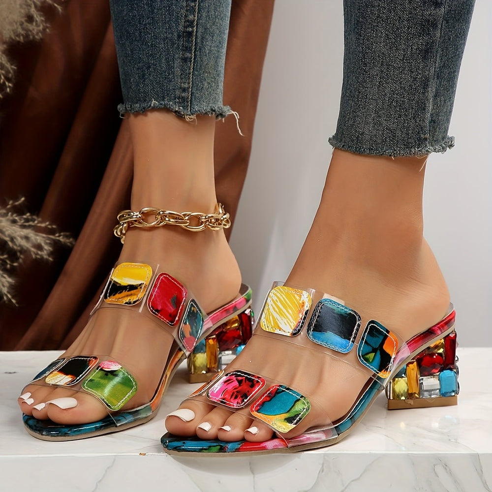 colorful rhinestone block heels with transparent PVC straps, worn on feet