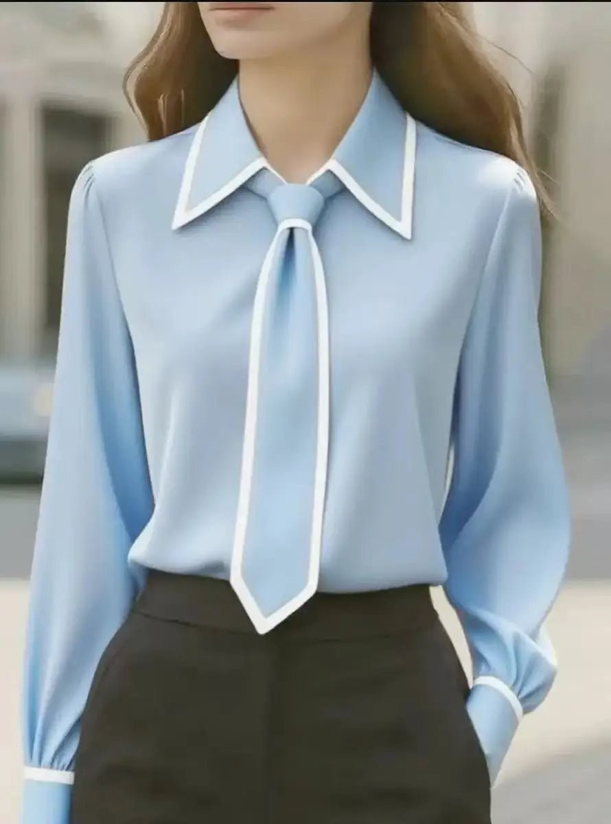 light blue tie-neck blouse with white piped collar and cuffs
