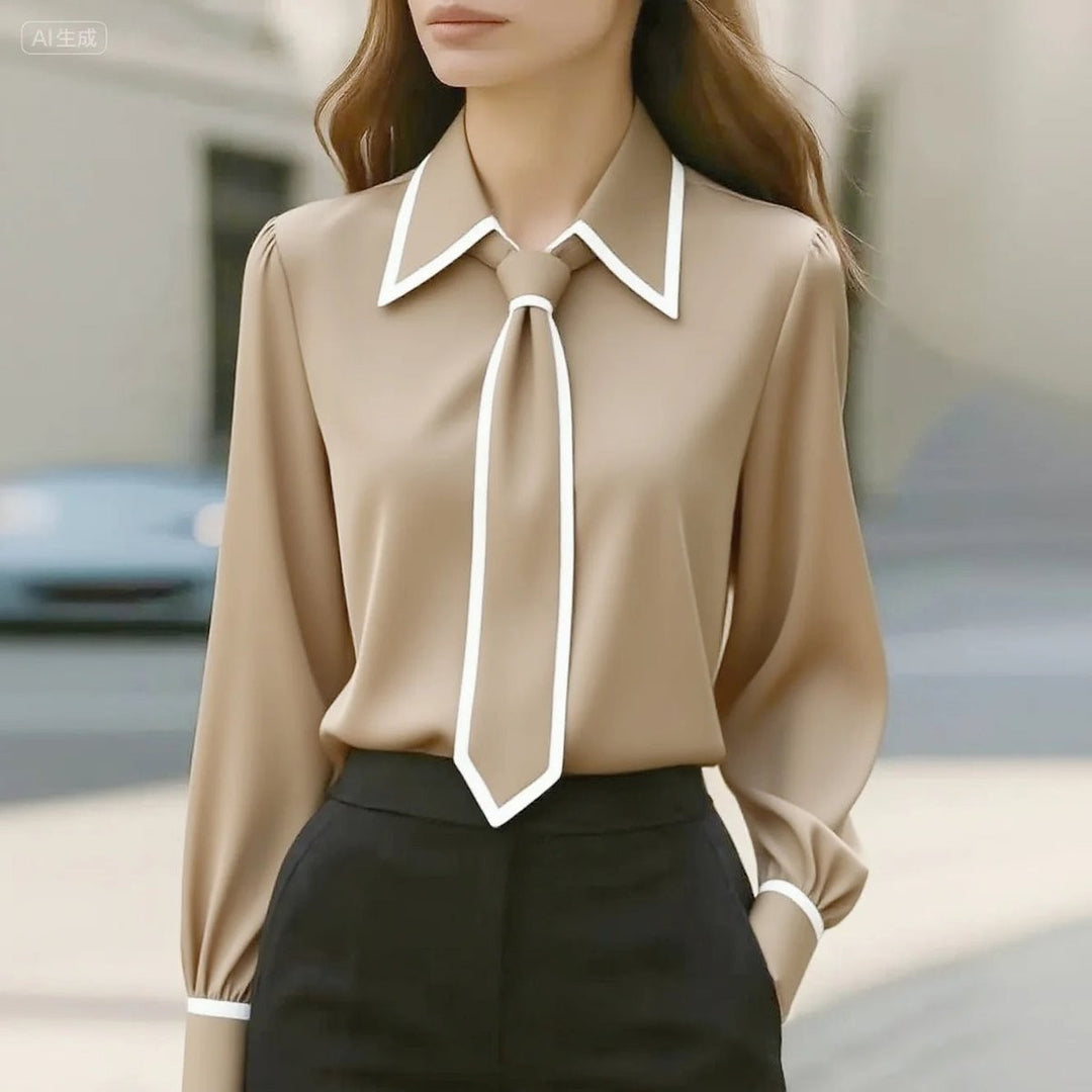 camel long-sleeve blouse with white piping and attached neck tie
