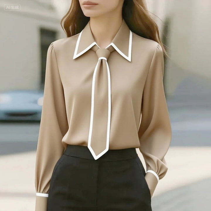 camel long-sleeve blouse with white piping and attached neck tie