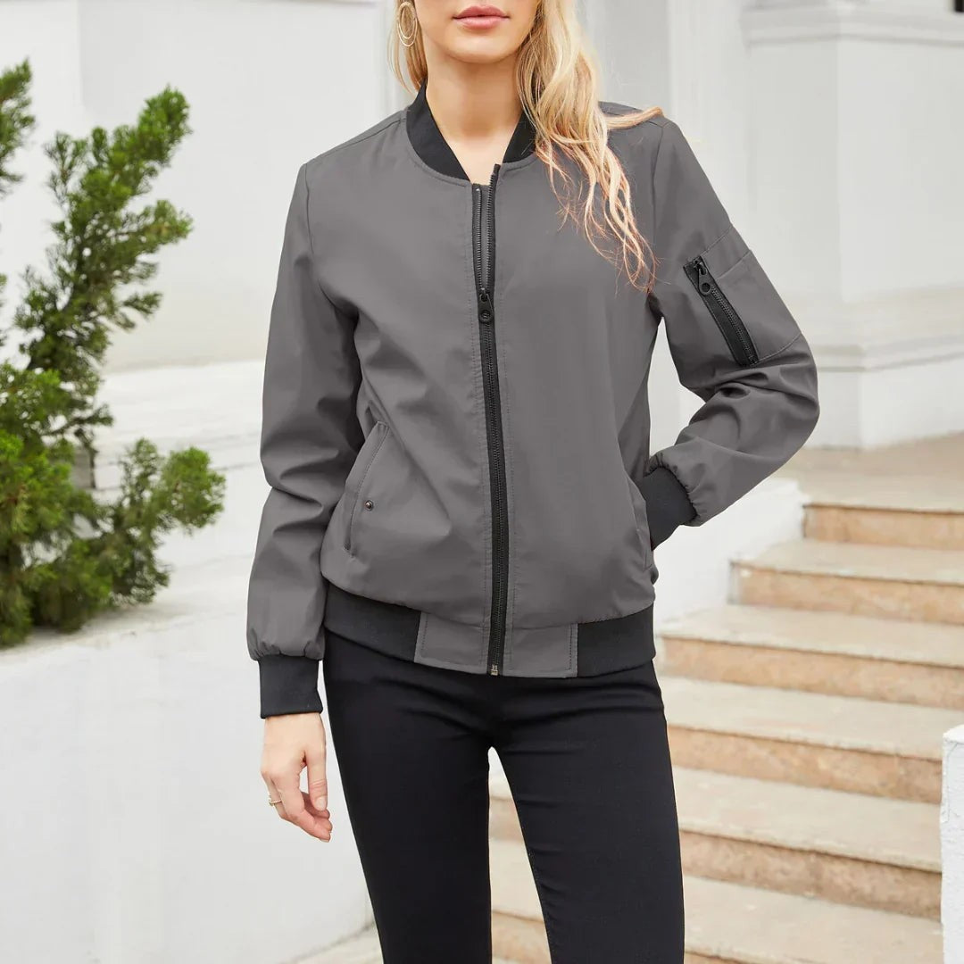 Grey zip-up bomber jacket with black ribbing and arm zip pocket