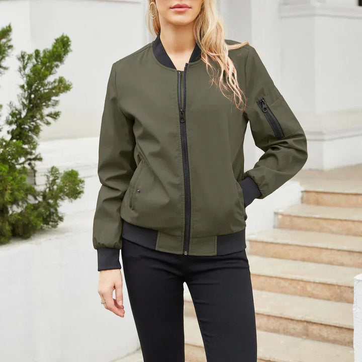 Khaki green bomber jacket with black ribbed hem and stand collar