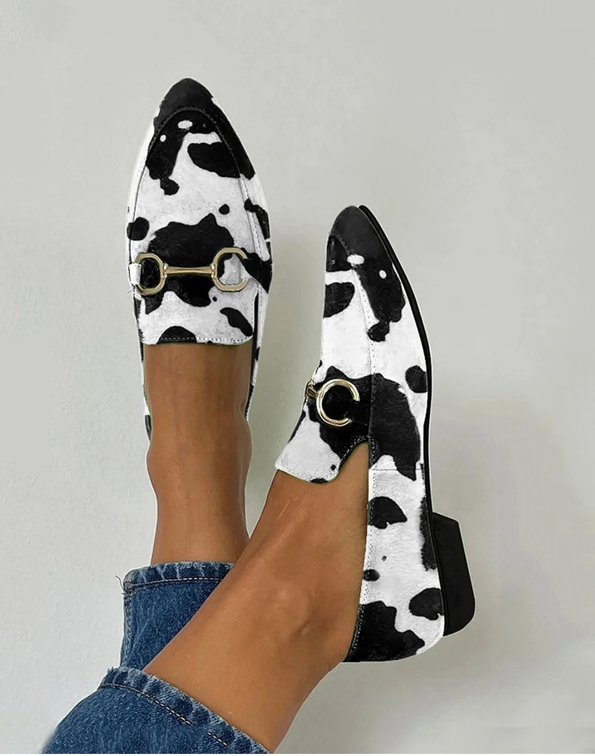Cow print pointed-toe loafers with gold horsebit buckle detail