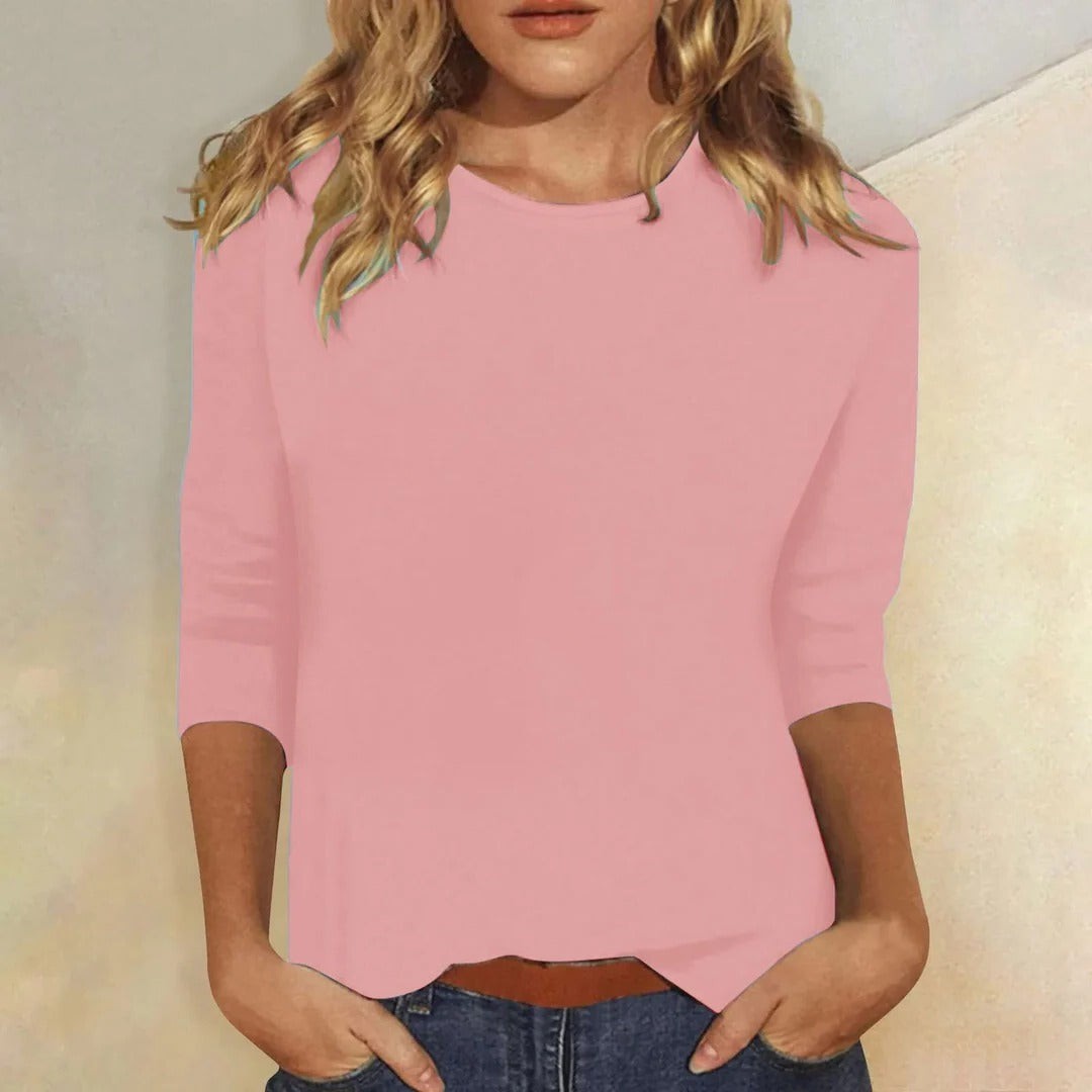pink crew neck three-quarter sleeve top with curved hem