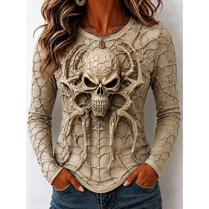 tan long sleeve top with 3D spider skull graphic print