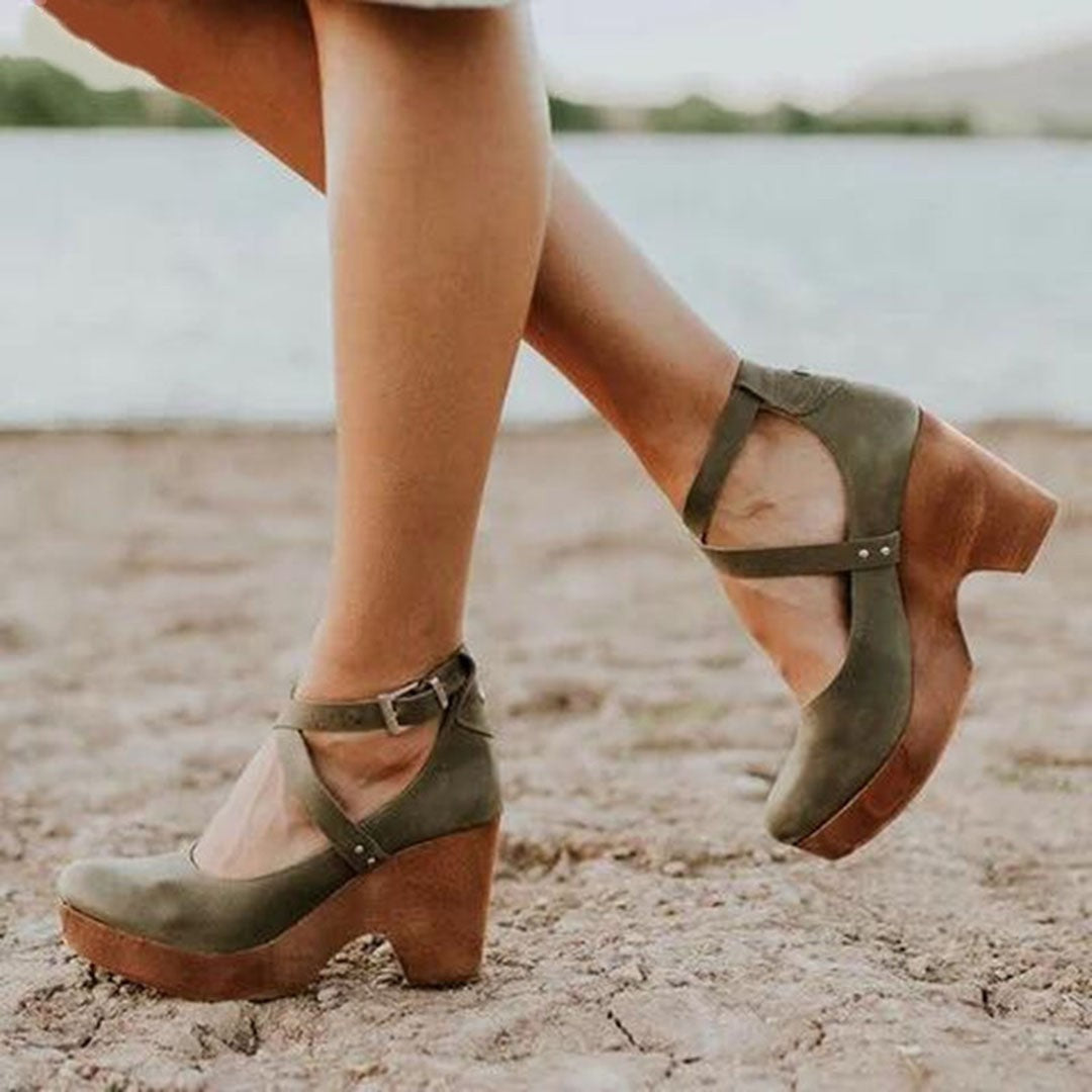 olive green wedge heels with crisscross ankle straps worn outdoors
