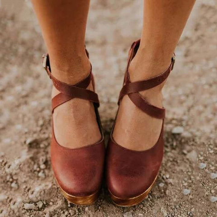 cognac leather wedge shoes with crisscross straps and closed round toe