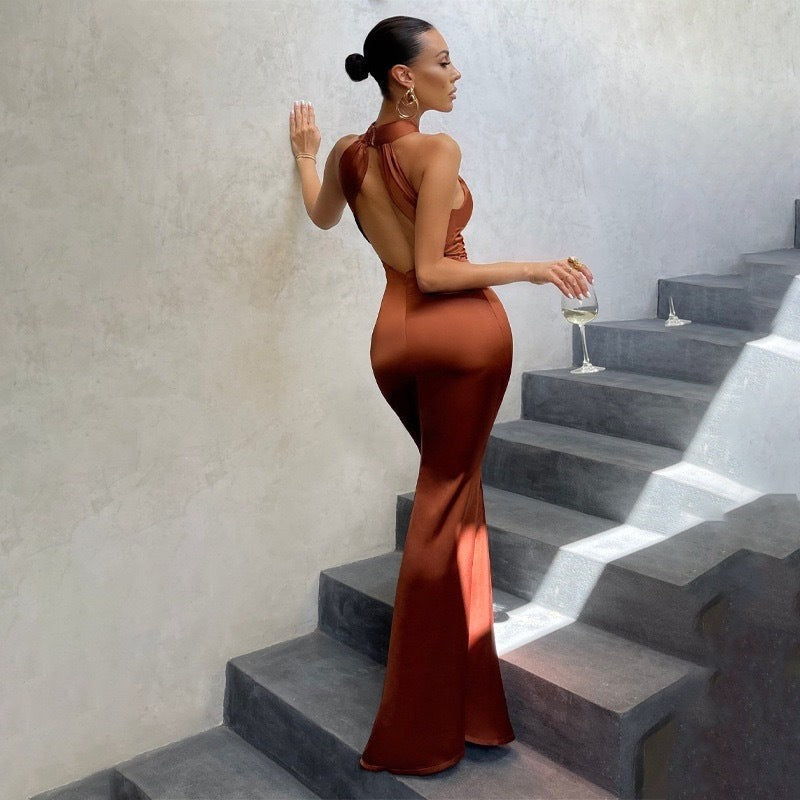Rust satin halter dress with open back and flared mermaid hem
