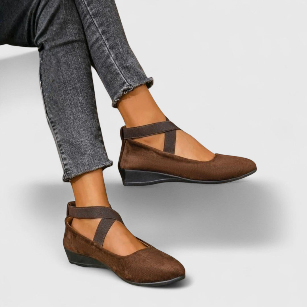 Brown suede wedge flats with crisscross ankle straps, side view