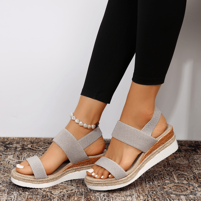Gray platform wedge sandal with pearl anklet and woven rope midsole