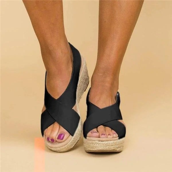 Black crisscross wedge sandal with espadrille platform sole, front view
