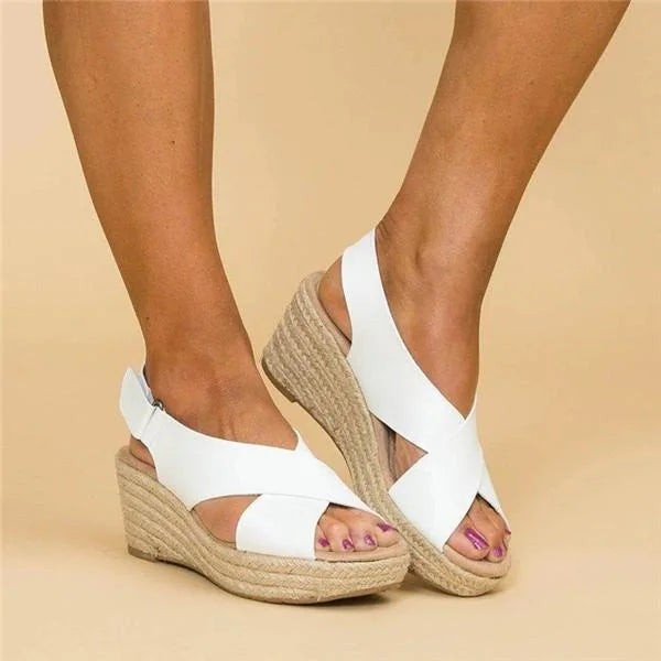 White crisscross strap wedge sandal with jute wrapped platform