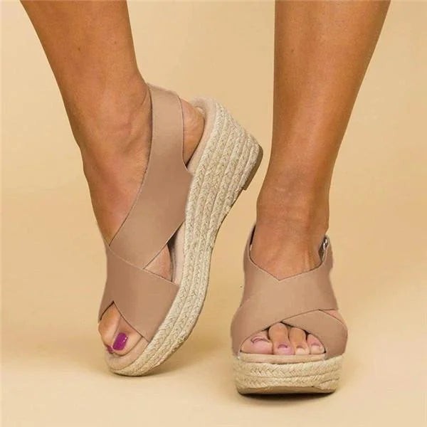 Taupe crisscross wedge sandal with braided platform, angled view