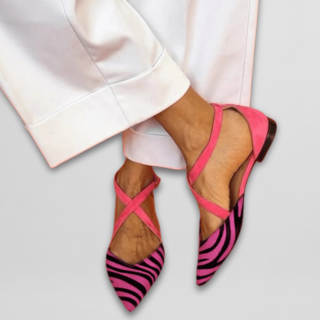 Pink suede crisscross flats with vibrant pink zebra-print pointed toe design