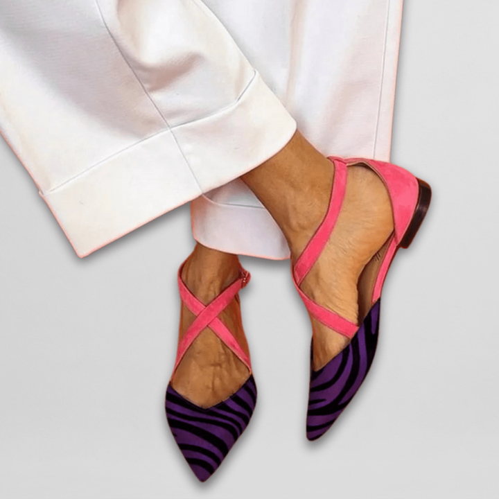 Purple zebra-print pointed flats accented with pink suede crisscross ankle straps