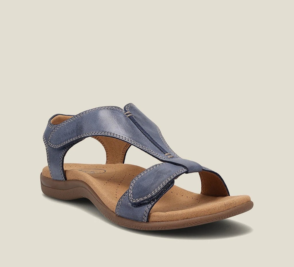 blue leather cushioned sandal featuring crisscross straps and arch support