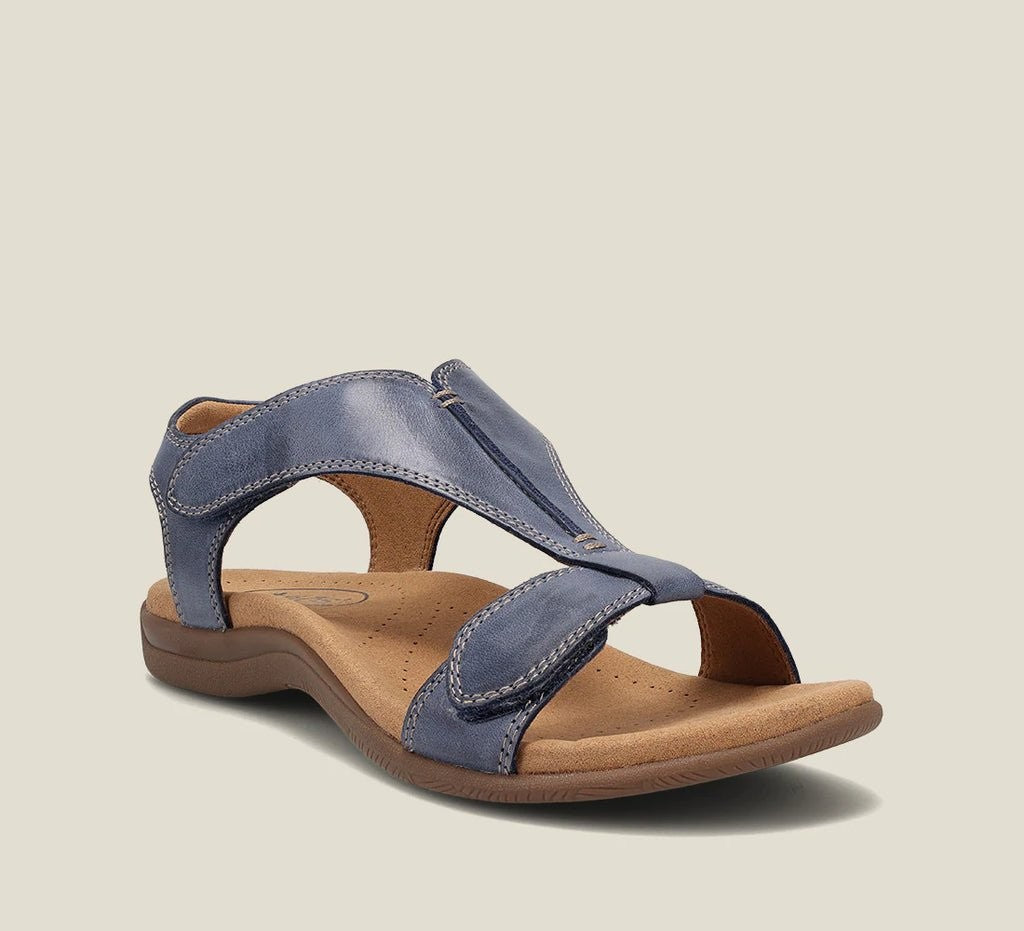 blue leather cushioned sandal featuring crisscross straps and arch support