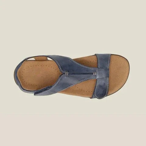 top view of blue leather sandal showing arch support and strap layout