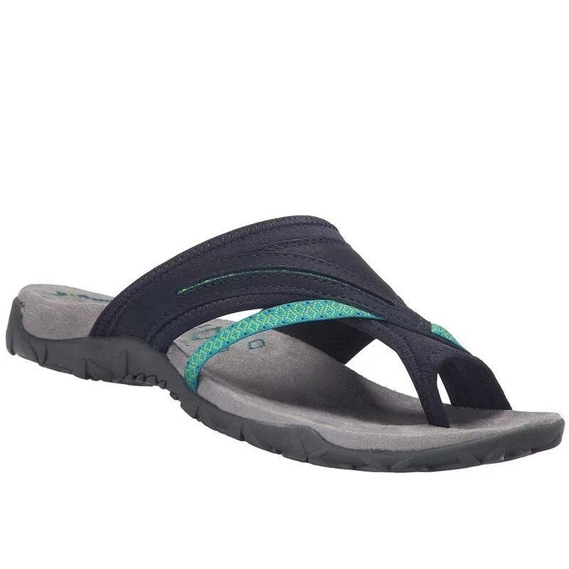 navy leather thong sandal featuring teal woven crisscross strap detail