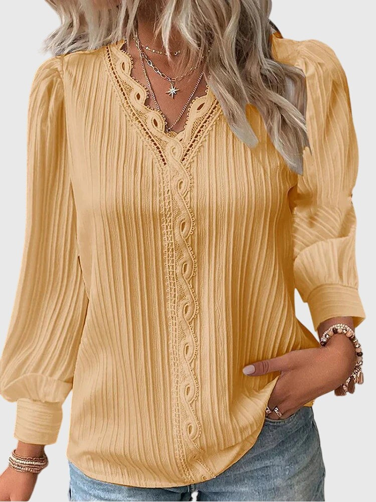 mustard yellow pleated blouse with lace-trim V-neck and puff sleeves