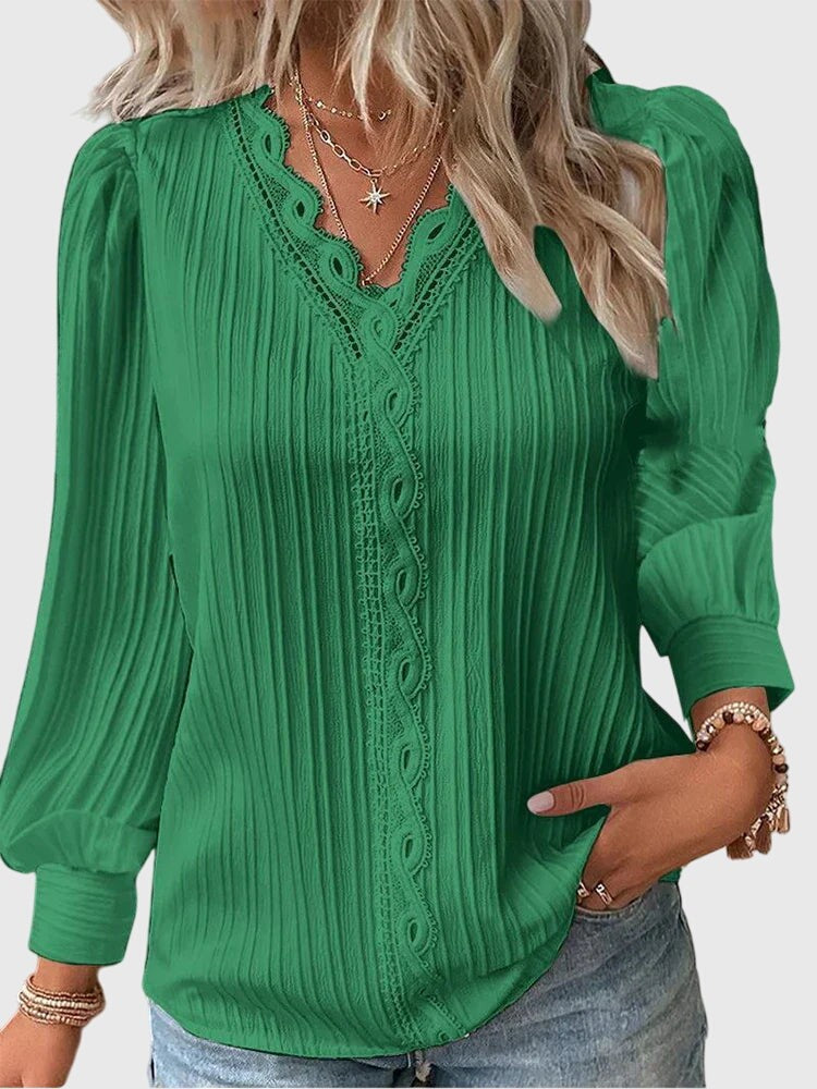 kelly green pleated blouse featuring crochet lace V-neckline detail