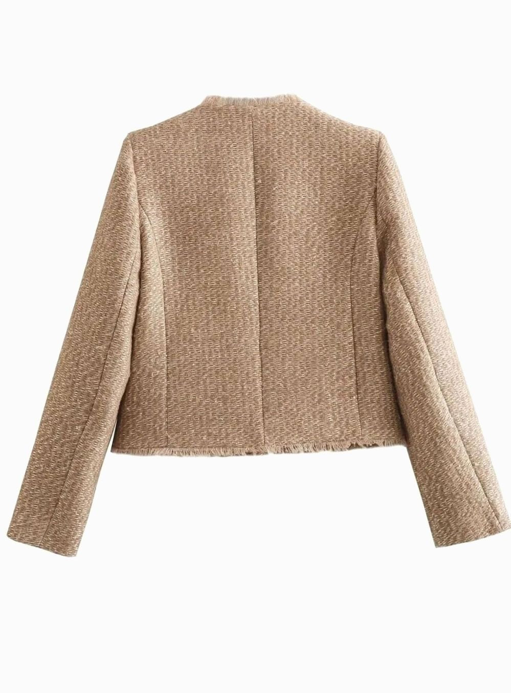 Back view of beige tweed cropped blazer showing frayed hem and tailored seams