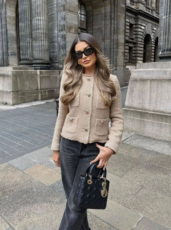 Taupe tweed cropped blazer with fringed collar, paired with black wide-leg jeans