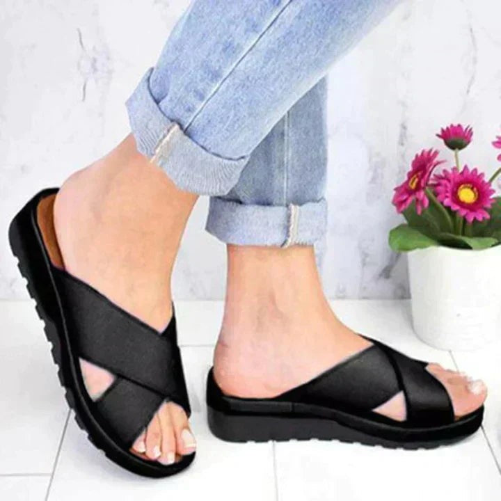 black criss-cross strap slide sandals with chunky platform sole