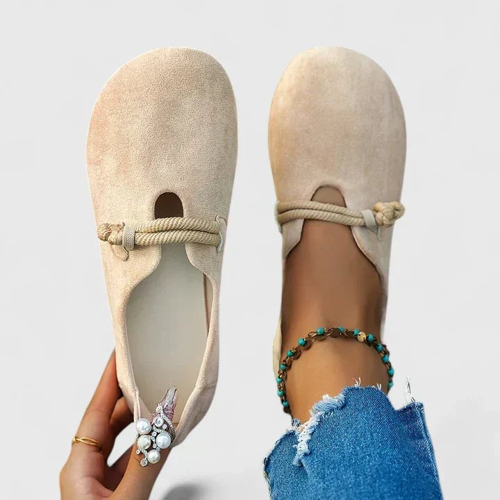 Beige suede loafers with knotted rope strap and round toe design