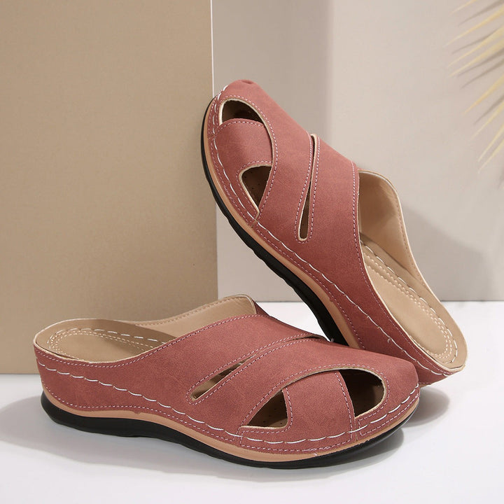 Dusty rose wedge sandals with crisscross vamp and tan sole accent