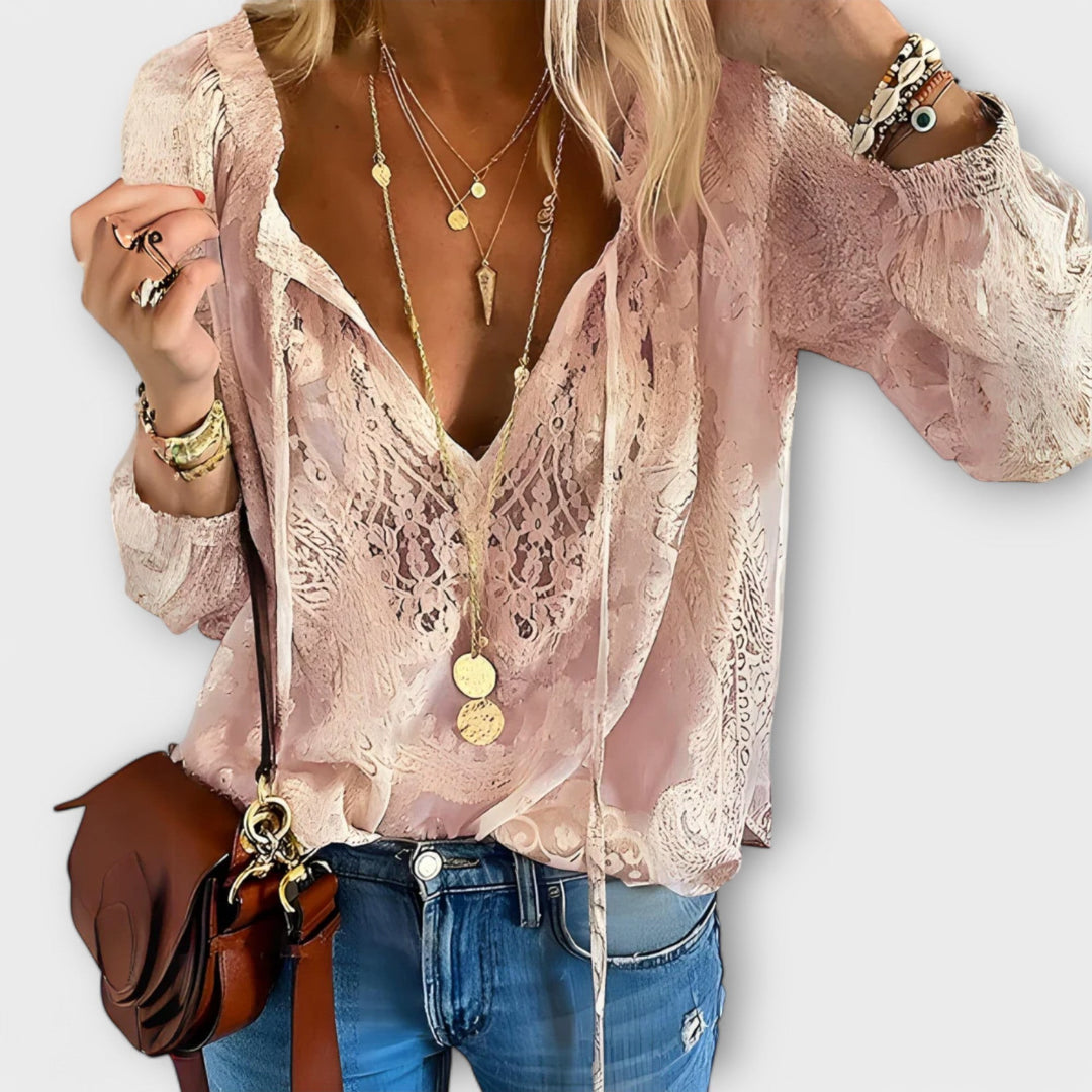 Blush pink lace V-neck blouse with sheer floral pattern and long sleeves
