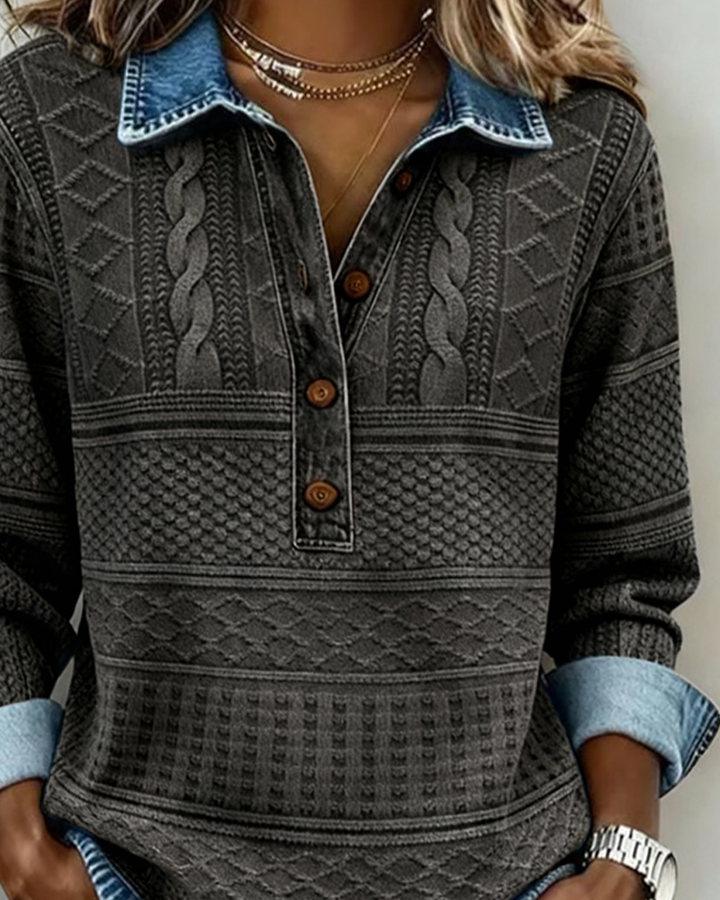 gray cable-knit sweater with denim collar and rolled cuffs