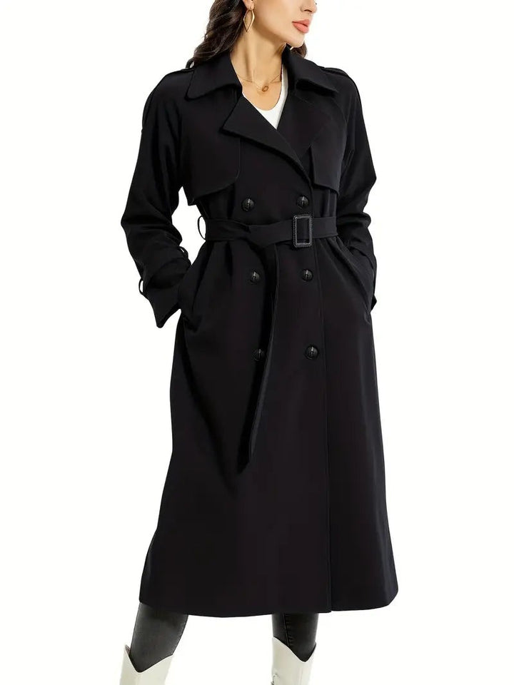 Black double-breasted trench coat featuring belted waist and notched lapel