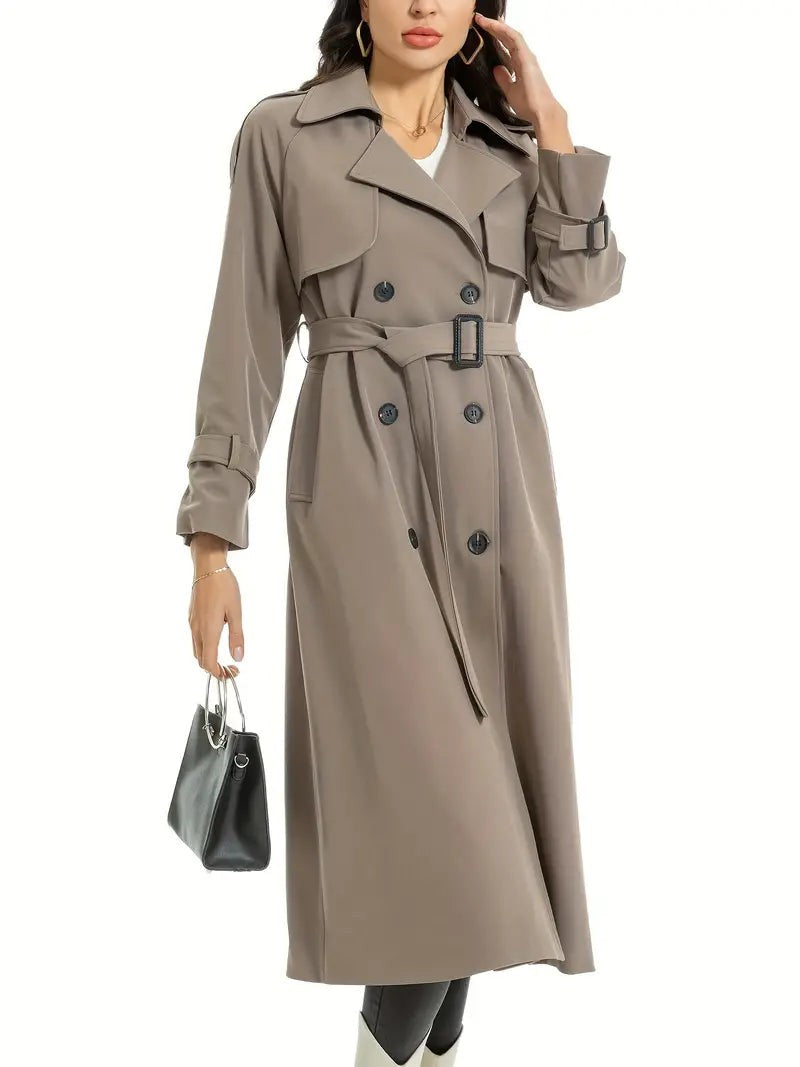 Taupe long trench coat with belted waist, worn with a black handbag