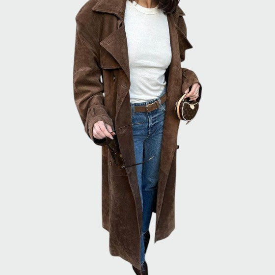 Brown suede trench coat worn over jeans with belted waist detail