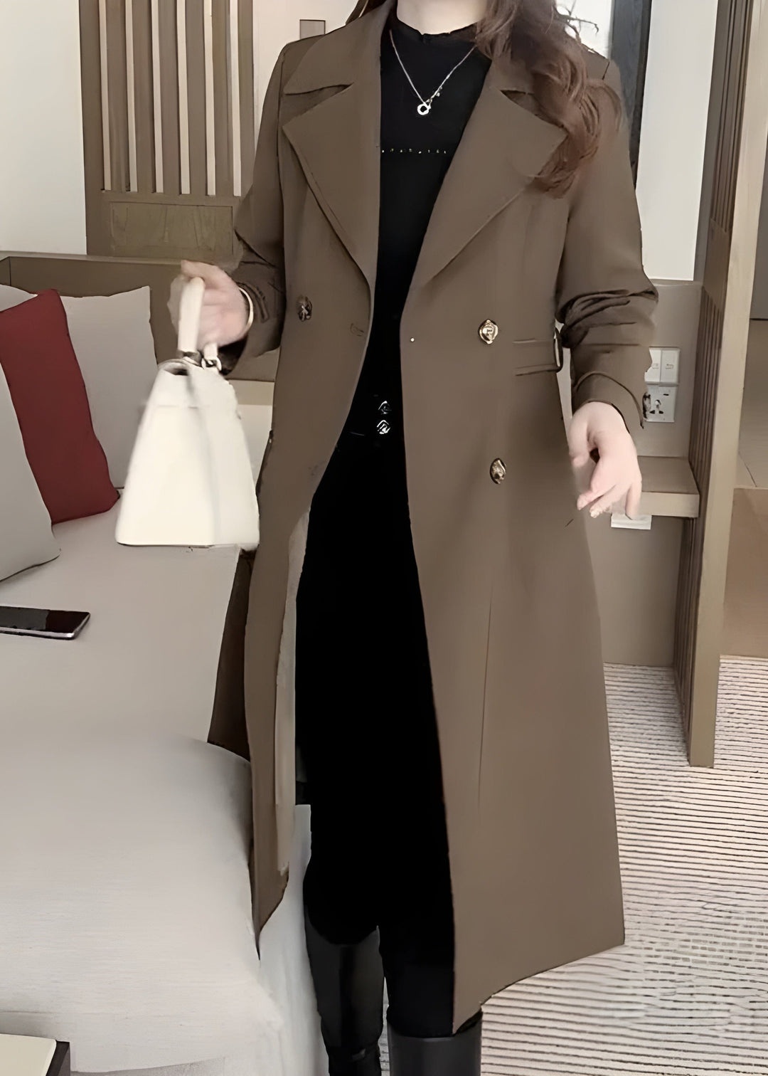 Brown double-breasted trench coat with gold buttons and tailored fit