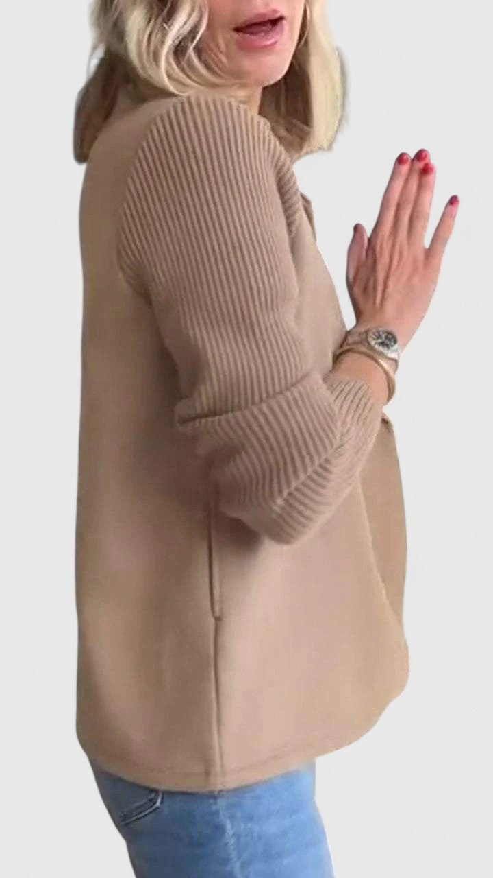 Side view of taupe blazer highlighting ribbed knit sleeve texture