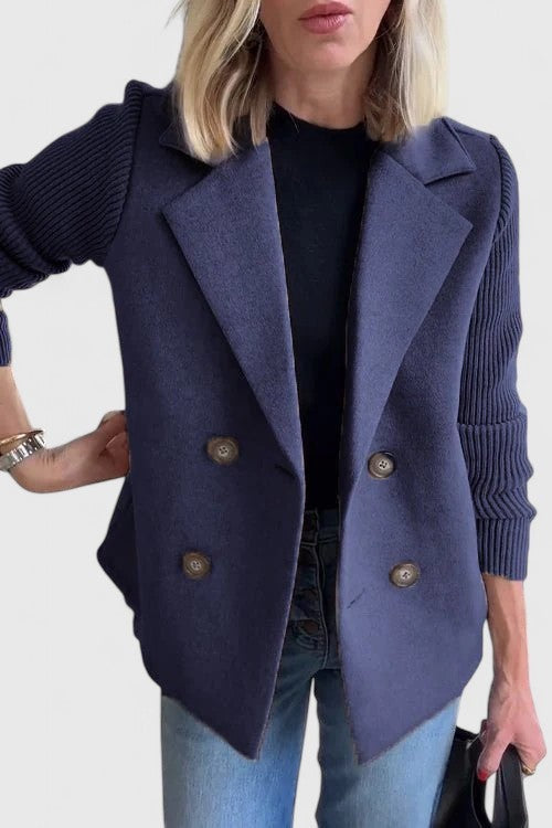 Navy double-breasted blazer styled with ribbed knit contrast sleeves
