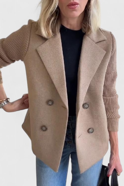 Taupe double-breasted blazer showing ribbed knit contrast sleeve detail