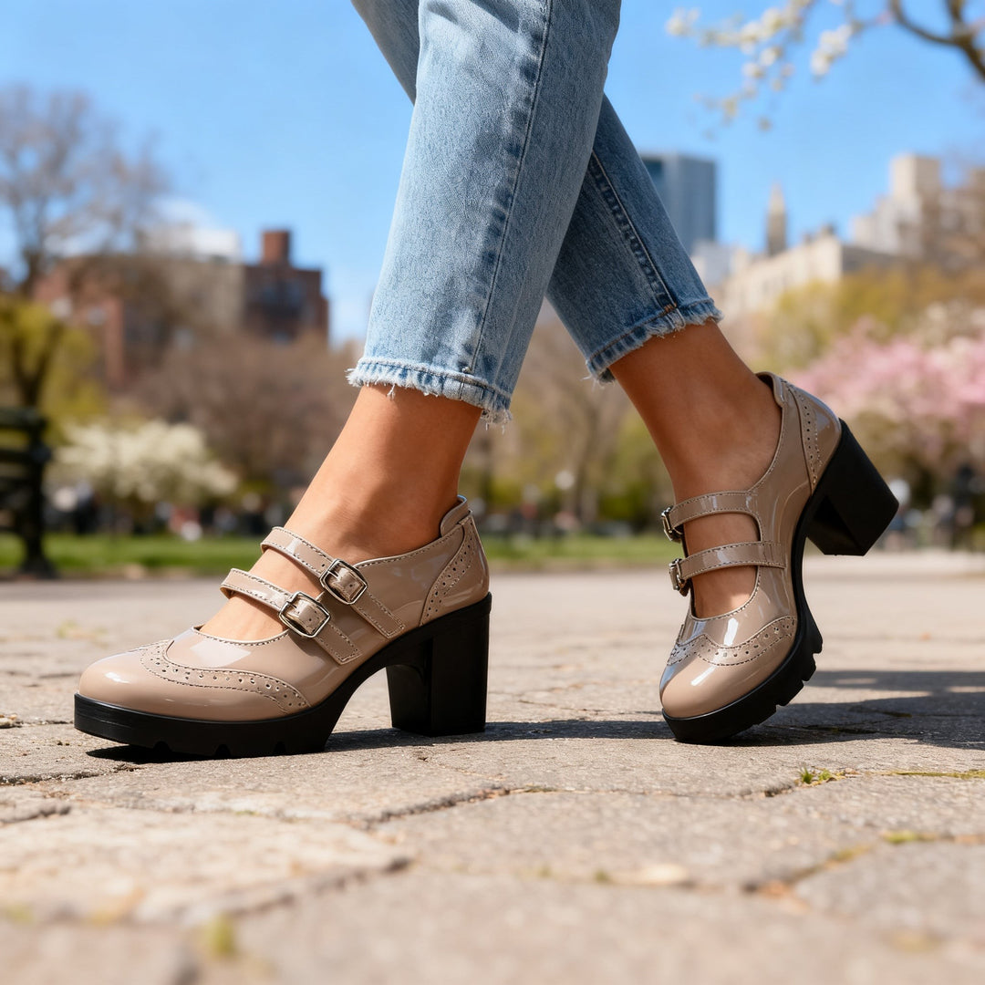 Taupe patent double-strap Mary Jane platform pumps styled with cropped jeans